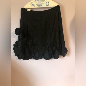 Knee length party skirt with flower appliqués